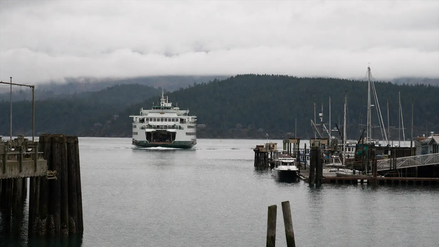 A Washington State ferry arriving at Friday Harbor under low cloud